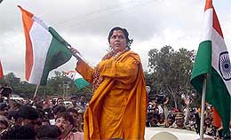 BJP leader Uma Bharti waves the Tricolour on her arrival at Hubli Railway Station on Wednesday. 
