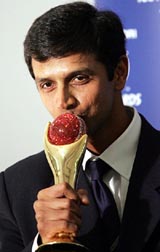 Rahul Dravid kisses one of his two awards for Player of the Year and Test Player of the Year at the ICC awards ceremony 
