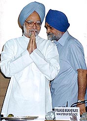 The Prime Minister and Chairman of the Planning Commission, Dr Manmohan Singh, with Deputy Chairman Montek Singh Ahluwalia at the first meeting of the full Planning Commission, at Yojana Bhavan, in New Delhi on Thursday.