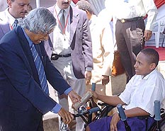 President A.P.J. Abdul Kalam talks to a special child during his visit to Uhuro School at the Bugurani camp for disabled children in Dar-es-Salaam on Monday.