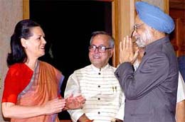 Prime Minister Manmohan Singh is greeted by Congress President Sonia Gandhi before his departure for London and New York