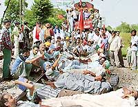 Kirti Kisan Union members disrupt rail traffic on the Ludhiana-Ferozepore track at Ghal Kalan village in Moga on Friday.  