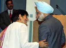 Prime Minister Manmohan Singh is greeted by Asia Society President Vishaka Desai at the Council of Foreign Relations in New York on Friday.