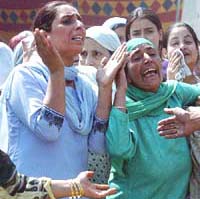 Relatives of Hurriyat leader Mohammad Rafiq Shah wail over his killing by militants at Chinkral Mohalla in downtown Srinagar on Thursday.