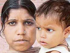 Allegedly sold off by her in-laws, Sarabjeet Kaur with her one-and-a-half-year-old daughter in Chandigarh on Friday.