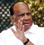 Union Agriculture Minister Sharad Pawar addresses a press conference at his residence in New Delhi on Sunday. 