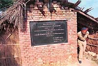 The foundation stone of the Kathlore bridge gives shelter to policemen. 