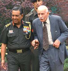 Field Marshal S.H.F.J. Manekshaw is escorted by the Chief of the Army Staff, Gen N.C. Vij, on his arrival at the former Army Chiefs conclave at Army House in Delhi on Friday. 