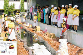 Students of Atam Public Senior Secondary School showing harm of pollution by constructing an artificial water body at a science exhibition in Ludhiana