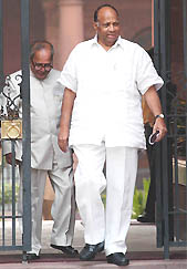 Union Agriculture Minister Sharad Pawar and Defence Minister Pranab Mukherjee coming out after a Cabinet meeting at South Block in New Delhi on Wednesday. 