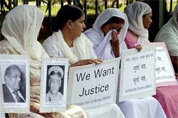 Women members of the All-India Sikh Conference hold a demonstration in New Delhi on Sunday demanding justice for the victims of the anti-Sikh riots of 1984