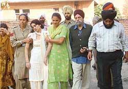 The four accused, (from right) Jolly, Mahinder Singh, Sabreen (white suit) and Babbu (extreme left), in the sensational suicide case come out of the Amritsar court complex after a hearing on Tuesday.