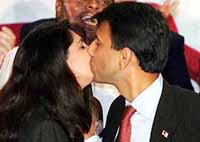 Congressman Bobby Jindal kisses his wife Supriya after his historic victory speech in New Orleans on Tuesday.