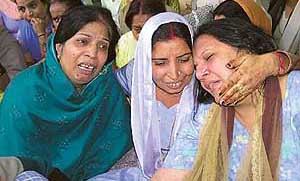 Neighbours try to console Ms Shreshtha and Ms Suman, the mothers who lost their children in a road accident in Jagadhri on Wednesday.