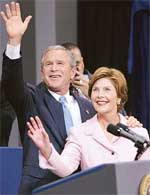 US President George W Bush waves as he stands with First Lady Laura Bush at the Ronald Reagan Center in Washington after delivering his victory speech on Wednesday. 