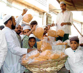 Muslims buy ‘sewaians’ after Jumma Namaz at a mosque in Field Gunj