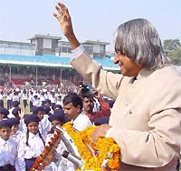 President A.P.J. Abdul Kalam waves to schoolchildren on the occasion of Childrens Day at a function at Ambedkar Stadium in New Delhi on Sunday. 