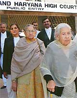 Indias first lady pilot, Beant Kaur (right), and her sister, Satwant Kaur, come out of the Punjab and Haryana High Court in Chandigarh on Thursday. 