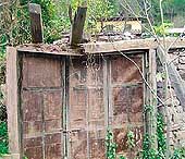 The locked gate of a shop abandoned by a Sikh trader in Muzaffarabad 57 years ago. 