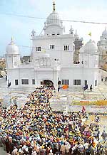 Devotees queue outside Gurdwara Katalgarh Sahib on the first day of the Shaheedi Samagam in Chamkaur Sahib on Sunday.