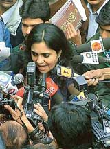 Ms Teesta Setalvad, a social activist, is surrounded by media persons after the Tehelka newspaper press conference at Press Club