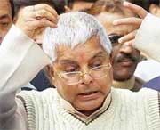 Union Railway Minister and RJD chief Laloo Prasad Yadav interacts with mediapersons after meeting the Chief Election Commissioner in New Delhi on Friday. 