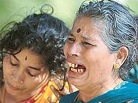 Mourners weep after seeing a relatives body in a mortuary in Cuddalore, 185 km south-west of Chennai, on Tuesday.