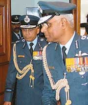 The new air chief, Air Chief Marshal S.P. Tyagi, comes out with the outgoing air chief, Air Chief Marshal S. Krishnaswamy, after taking charge at Air Headquarters in New Delhi on Friday.