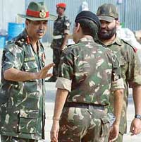 The Commander-in-Chief of the Integrated Services of Andaman and Nicobar, Lt-Gen B.S. Thakur (left), instructs Army personnel about relief operation in Car Nicobar. 