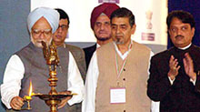 Mr Manmohan Singh lights a lamp to inaugurate the third Pravasi Bharatiya Divas in Mumbai on Friday.
