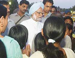 Prime Minister Manmohan Singh talks to tsunami survivors at a relief camp in Port Blair on Saturday. 