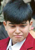 Harry Chaudhry, winner of the Sanjay Chopra Award for bravery, fails to control his tears as he remembers his sister whom he tried to save from an armed assailant on July 26, 2004, during a Press conference in New Delhi on Tuesday.
