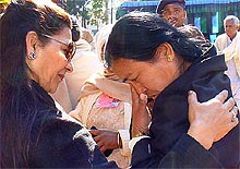 Seema Devi, wife of Subedar Pardeep Thapa of 4/5 GR, who was decorated posthumously with the Sena Medal for gallantry for his actions on the LoC, is consoled by Mrs Anupama Singh, wife of the GOC-in-C, Western Command, Lieut-Gen J. J. Singh, during an investiture ceremony in Dehra Dun on Wednesday. 
