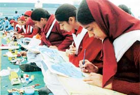 Students take part in a painting contest organised in the Guru Nanak Stadium