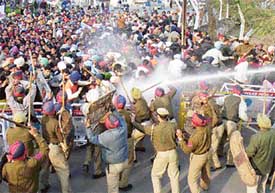 Policemen lathicharge members of the Unemployed Elementary Teachers Union, Punjab, who were protesting in front of the Punjab Chief Minister’s residence in Patiala on Saturday.