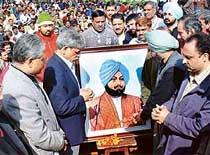 Tribune employees pay homage to Sardar Dyal Singh Majithia on the occasion of the Foundation Day of The Tribune in Chandigarh on Wednesday. 