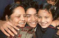 DPS student Kislay Kaushik is greeted by his mother and sister after he was rescued from the kidnappers, in Patna on Wednesday. 