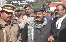 Samajwadi Party MP Atiq Ahmad comes out of the Allahabad District Courts where he surrendered before the Chief Judicial Magistrate on Saturday. Ahmad was named in an FIR in connection with the murder of BSP MLA Raju Pal on January 25.