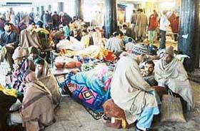 Passengers at the Jammu bus terminal as the Jammu-Srinagar national highway was closed for the second day