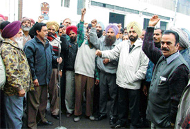 Activists of the Uttariya Railway Mazdoor Union hold a gate rally at the diesel shed to press for their demands in Ludhiana
