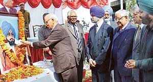 The Chairman of the The Tribune Trust, Justice R.S. Pathak, pays floral tributes to Sardar Dyal Singh Majithia to celebrate the 124th foundation day of the newspaper in Chandigarh on Friday
