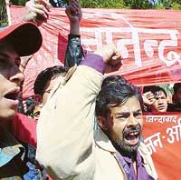 Nepal activists participate in a demonstration against the Nepal King at Jantar Mantar in New Delhi on Sunday.