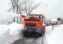 A snow-removing machine of the Border Roads Organisation in action near the Jawahar Tunnel on the Srinagar-Jammu National Highway on Monday to restore two-way traffic on the arterial road connecting Kashmir with the rest of the country. 