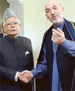 Afghan President Hamid Karzai (right) shakes hands with External Affairs Minister Natwar Singh before a meeting in New Delhi on Wednesday. 