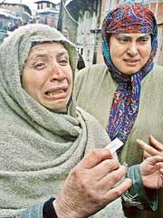 Wailing relatives of a youth trapped in a government building during an attack in Srinagar on Thursday.