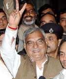 Mr Bhupinder Singh Hooda shows the victory sign after coming out from a meeting at Parliament Annexe in New Delhi on Friday.