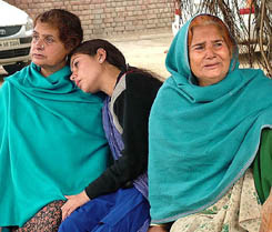 Relatives of Pooja, who, along with her two children, was reportedly killed by her husband on Friday, outside Civil Hospital in Jalandhar.