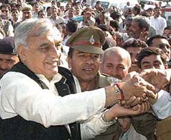 Mr Bhupinder Singh Hooda mingles with the crowd as he arrives to be sworn in as Chief Minister of Haryana at Haryana Raj Bhavan in Chandigarh on Saturday. 