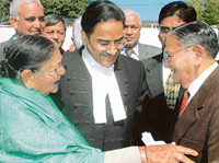 Mr Justice D.K. Jain receives the blessings of his parents soon after he took the oath as Chief Justice of the Punjab and Haryana High Court at Haryana Raj Bhavan in Chandigarh on Friday.