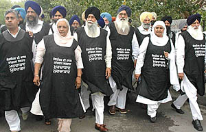 SAD members, including its President, Mr Parkash Singh Badal, hold a protest rally outside Punjab Vidhan Sabha in Chandigarh on Friday.